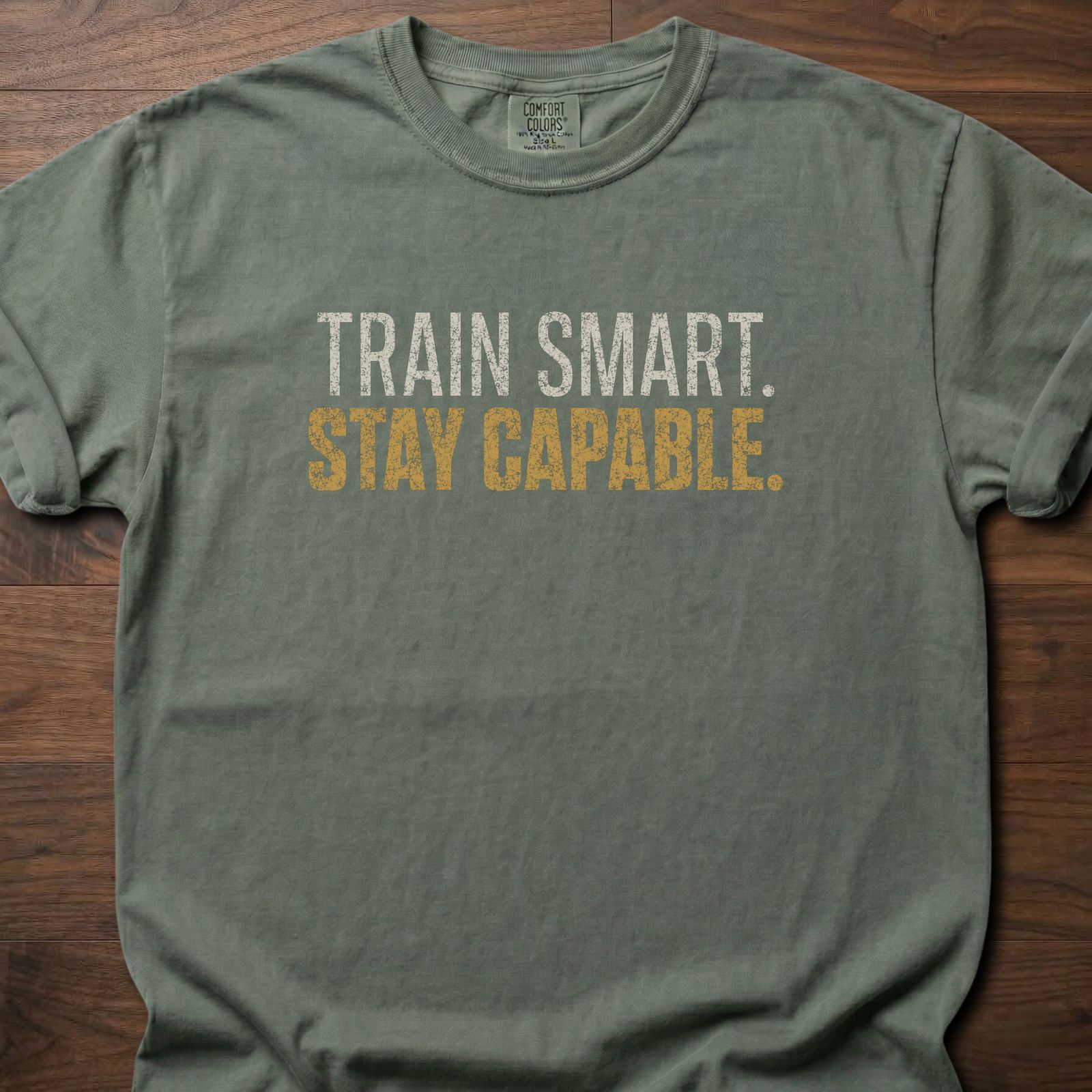 Train Smart Stay Capable strength training t-shirt with bold two-tone distressed lettering – Moss