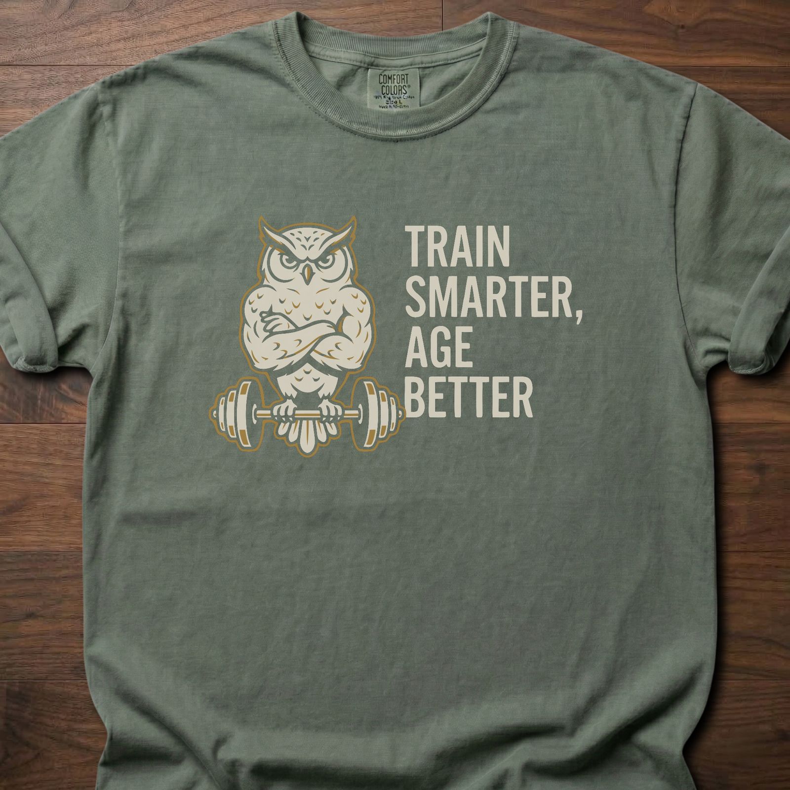 Train Smarter Age Better strength training t shirt featuring wise owl lifting barbell design – Moss