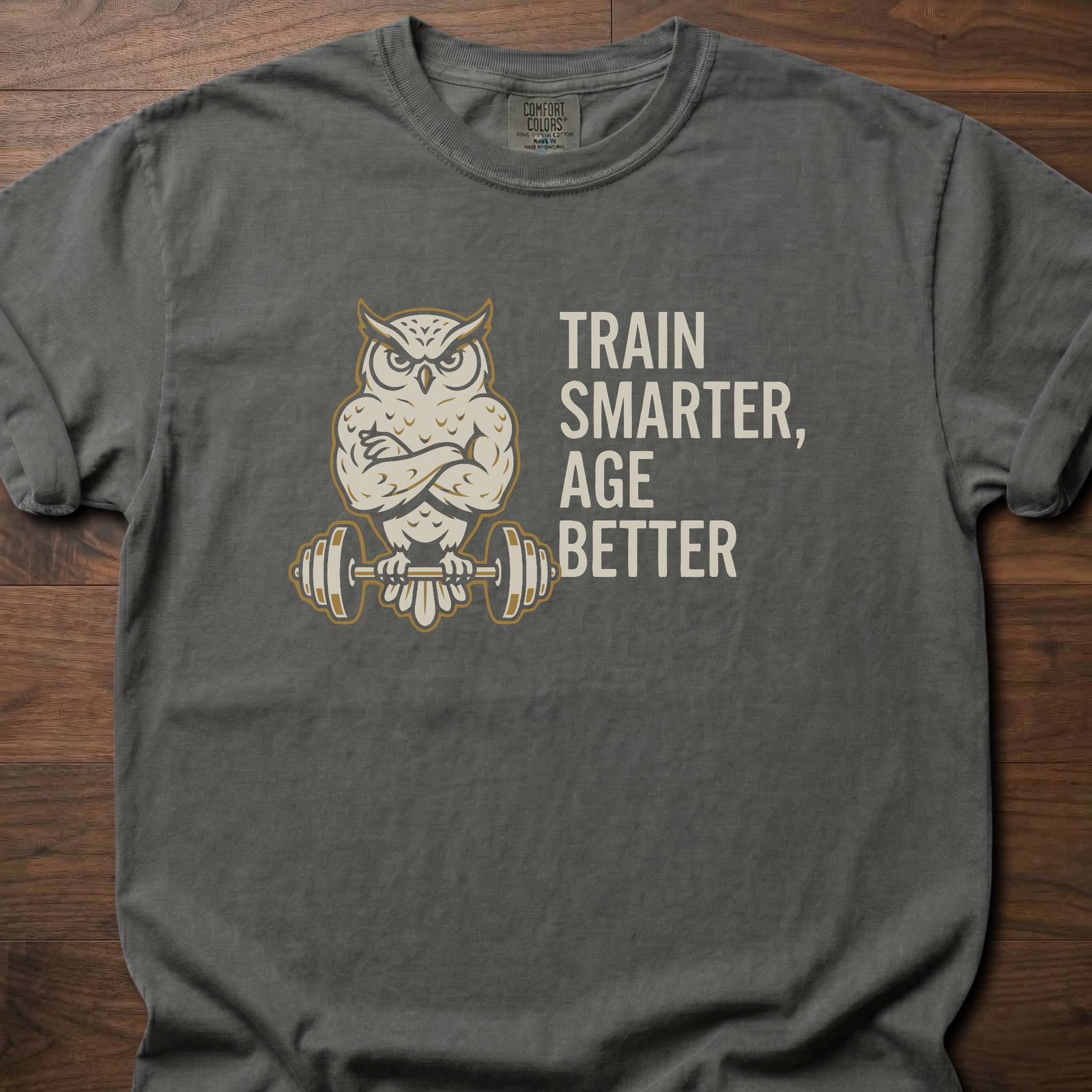 Train Smarter Age Better strength training t shirt featuring wise owl lifting barbell design – Pepper