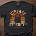 Vintage Strength fitness lifestyle t-shirt featuring retro sunset with kettlebell silhouette – Black