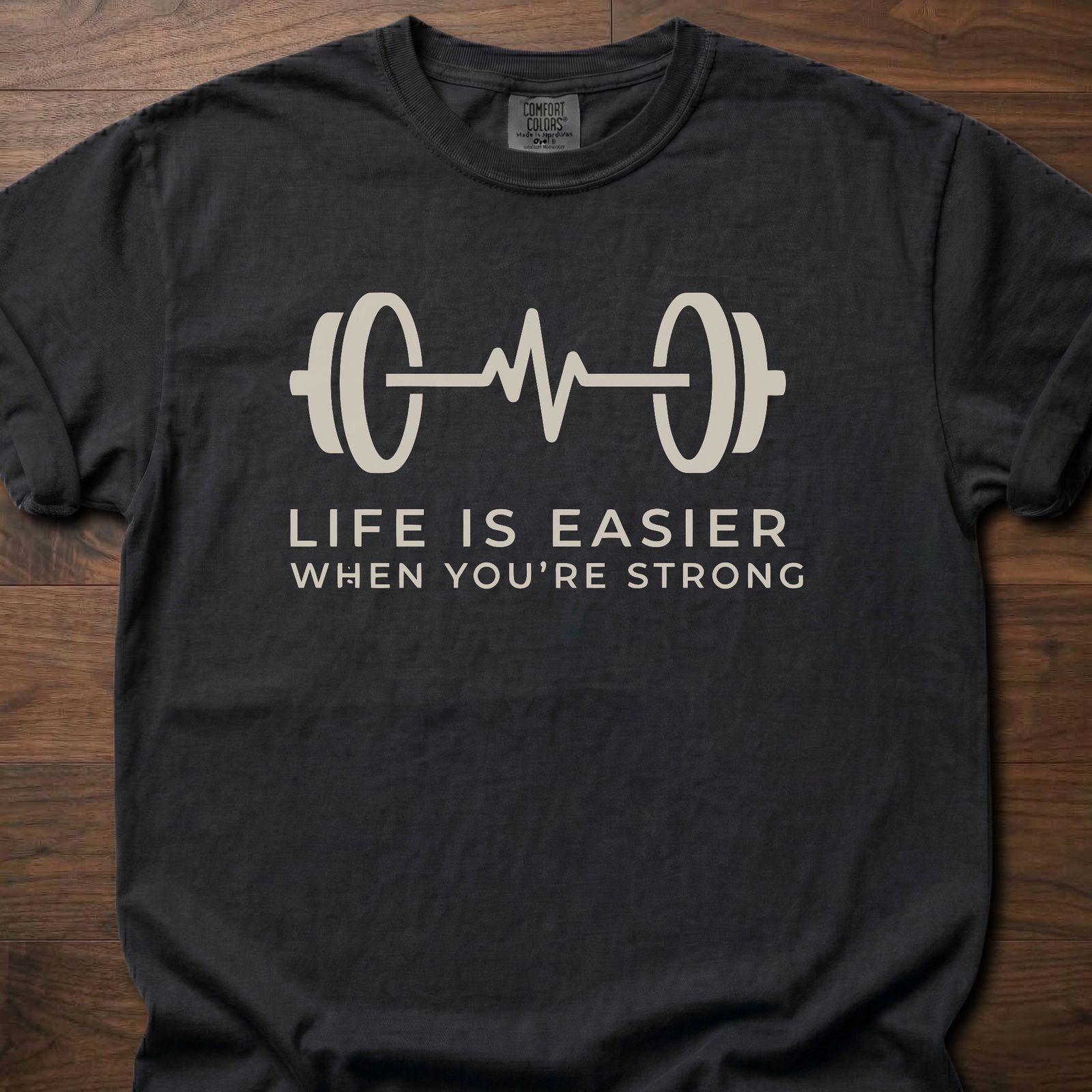 When You're Strong strength training t-shirt with barbell heartbeat design and motivational text – Black