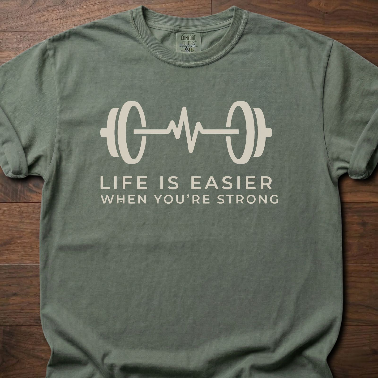 When You're Strong strength training t-shirt with barbell heartbeat design and motivational text – Moss